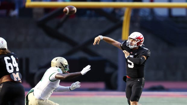 Milton quarterback Luke Nickel passes against Buford.