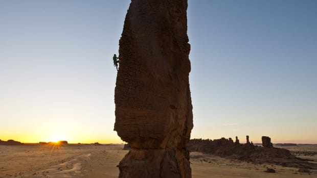 A climber scales a rock wall