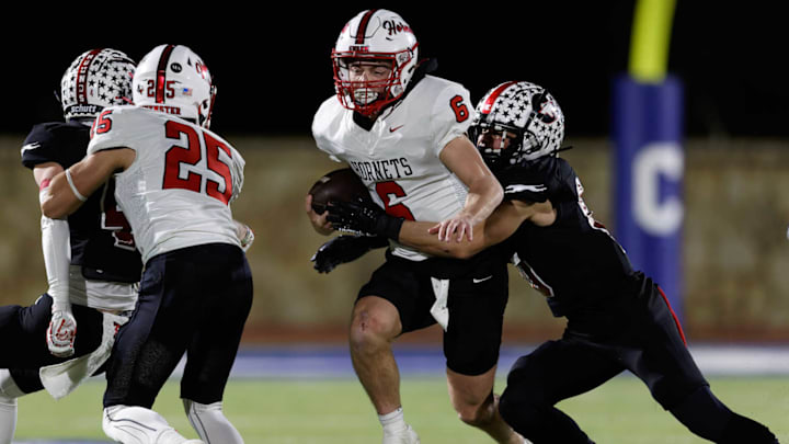 Muenster quarterback Casen Carney runs during the semifinal game against Gruver. 