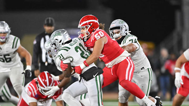 Mater Dei defensive lineman Montana Toilolo (50), ranked the 30th top junior in California by 247Sports, tackles De La Salle running back Dominic Kelley for a loss in 2024 CIF State Open Division football game. Mater Dei defensive lineman Montana Toilolo (50), ranked the 30th top junior in California by 247Sports, tackles De La Salle running back Dominic Kelley for a loss in 2024 CIF State Open Division football game.