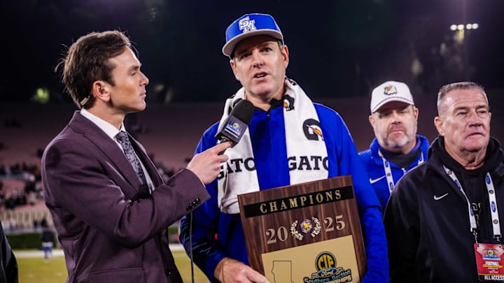 Santa Margarita football coach Carson Palmer holds the CIF Southern Section Division 1 plaque after his Eagles beat Corona Centennial in the final at the Rose Bowl. Santa Margarita football coach Carson Palmer holds the CIF Southern Section Division 1 plaque after his Eagles beat Corona Centennial in the final at the Rose Bowl.