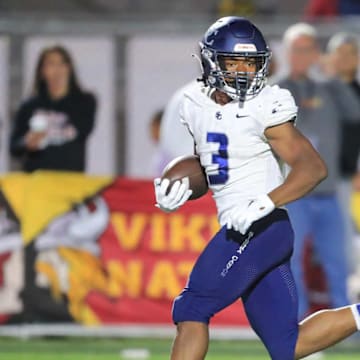 Sierra Canyon running back Jaxsen Stokes breaks into the open field on a run against Downey.