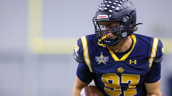 Highland Park tight end Cash Nix runs with the ball after a catch in a game earlier this season in Dallas. Highland Park tight end Cash Nix runs with the ball after a catch in a game earlier this season in Dallas.