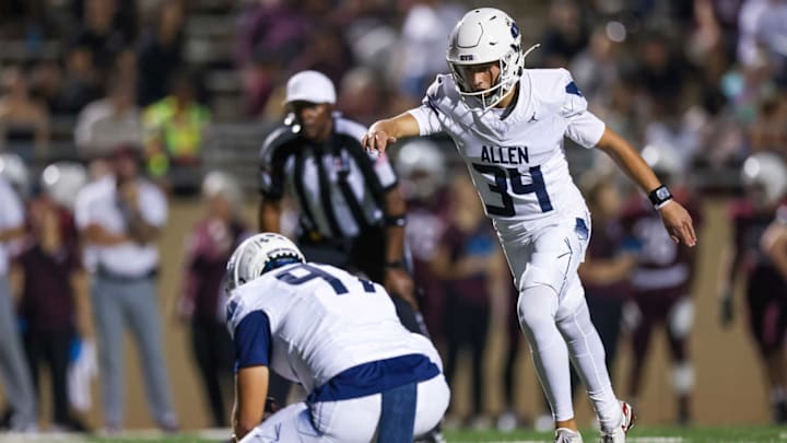 Allen's Preston Hurless boots a PAT in a win against Allen on Sept. 19. 