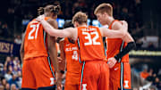 Illinois players huddle up during the Illini's 80-77 win over Washington on Sunday at Alaska Airlines Arena in Seattle.