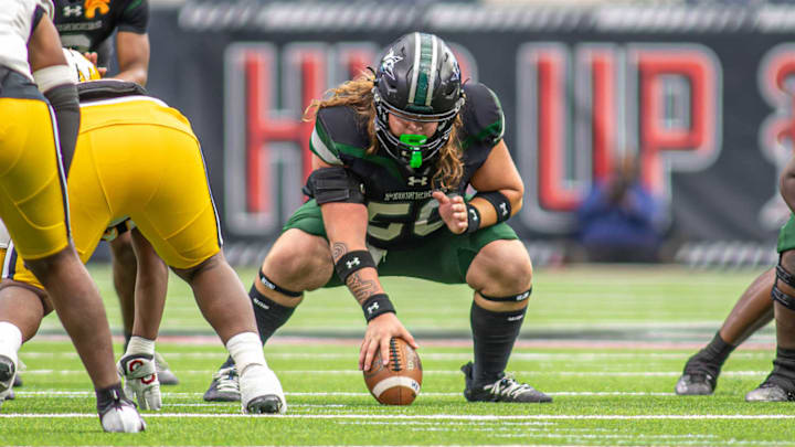 Iowa Colony center Tyson Windham prepares to snap the ball in a game against Fort Bend Marshall on Nov. 29 at NRG Stadiium in Houston. 