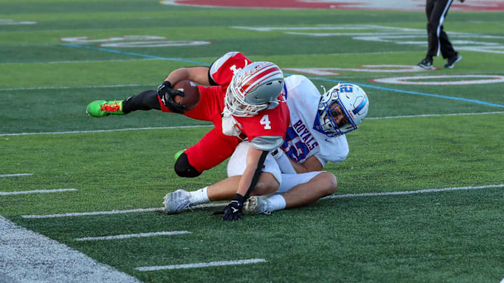 Hamilton Southeastern defender tackles a Fishers player during their game on Sept. 12, 2025