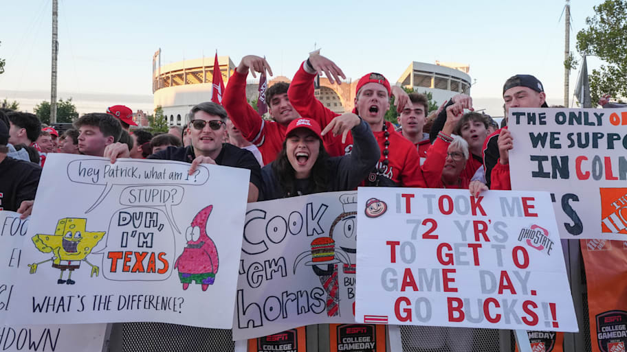 Ohio State fans hold up signs outside of ESPN’s ‘College GameDay.’