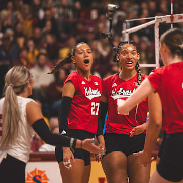 Taylor Landfair, center, celebrates with her teammates after a points against Nebraska. Landfair, who spent her first four years at Minnesota, put up 11 kills on 20 swings against the Gophers. 