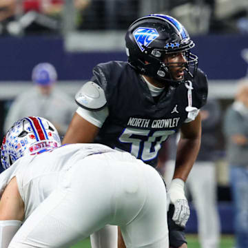 North Crowley's John Turntine III, right, announced he will play at Texas during a ceremony on July 4. He's one of the top returning offensive linemen.