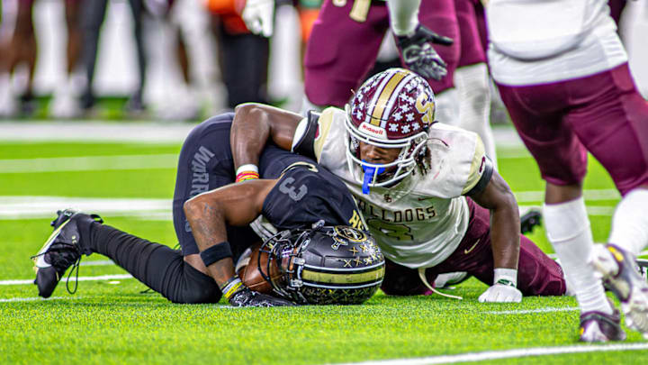 Humble Summer Creek's Brandon Jones makes a tackle earlier this year against Katy Jordan.