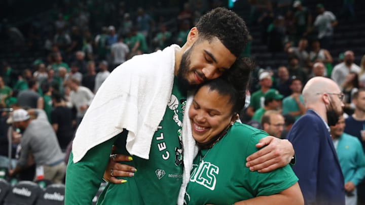 Jayson Tatum embraces his mother Brandy Cole after a win.