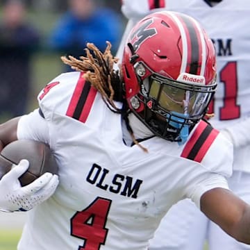 Orchard Lake St. Mary’s wide receiver Bryson Williams runs for extra yardage against the Birmingham Groves defense during first half action between the two schools n the MHSAA Division 2 semifinal game at West Bloomfield High School in West Bloomfield on Saturday, Nov. 23, 2024.
Orchard Lake St. Mary’s won the game 28-27 in one overtime.