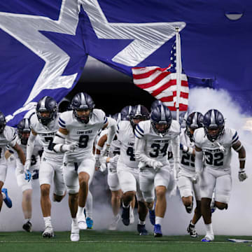 The Lone Star Rangers take the field against Highland Park on Dec. 5, 2025. The Rangers won 58-38.