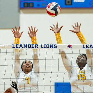 Cypress Ranch players Dayla Fields (7) and Madyson Carr (15) go for a block in game against Duncanville earlier this season. Cypress Ranch qualified for the Class 6A Division I playoffs. 