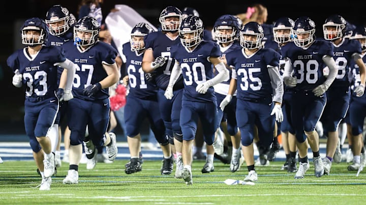 The Oil City Oilers run onto the field in a game against the Corry Beavers on October 25, 2024. The Oil City Oilers run onto the field in a game against the Corry Beavers on October 25, 2024.