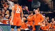 Illinois coach Brad Underwood communicates with Illini swingman Tre White (22) during the team's 80-77 win over Washington on Sunday at Alaska Airlines Arena in Seattle.