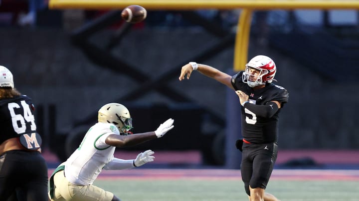 Milton quarterback Luke Nickel releases a first half pass against Buford in the Eagles 13-10 win over the Wolves in the season opener for both teams, Friday night.