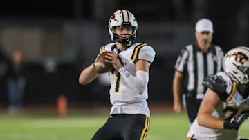 Newbury Park prolific junior quarterback Brady Smigiel, in the pocket during his team's 48-20 win over Calabasas on Oct. 10. Smigel completed 11 of 19 for 239 yards and four touchdowns, and he caught a 36-yard TD. His favorite target Shane Rosenthal had six catches for 167 yards and two touchdowns. 