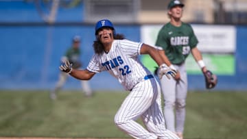 High School baseball from CIF Central Section: Frontier-Bakersfield high school junior Laylen Tia checks the ball in flight while running bases in a 7-1 win over Garces Memorial. Garces sophomore Gavin Williams looks on.