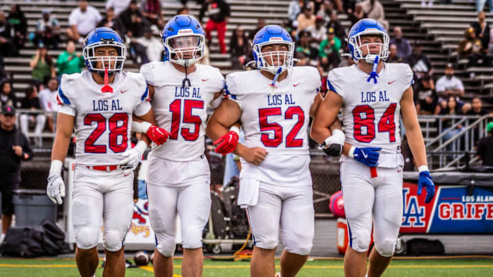 Los Alamitos captains take the field before taking on Inglewood on August 25, 2025.
