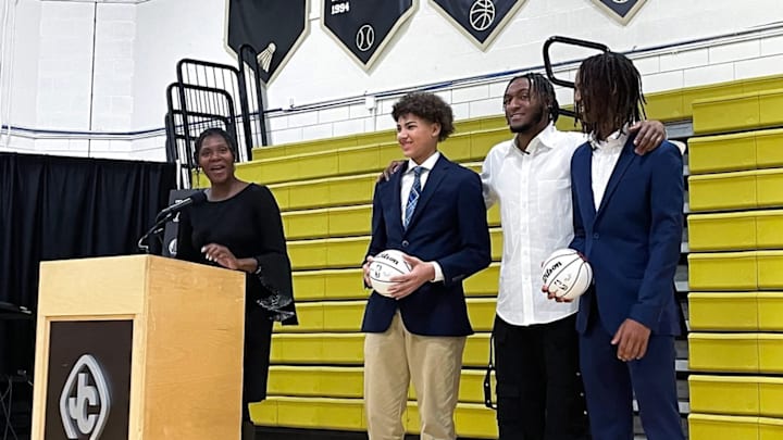 Toronto Raptors star Immanuel Quickley (white shirt) is flanked by the winners of the inaugural Immanuel Quickely Scholarship Awards, Christian Snead (right) and Julian White, at John Carroll School, Quickley's high school alma mater. At the podium, Quickley's mother, Nitrease Quickley, announces the awards. Toronto Raptors star Immanuel Quickley (white shirt) is flanked by the winners of the inaugural Immanuel Quickely Scholarship Awards, Christian Snead (right) and Julian White, at John Carroll School, Quickley's high school alma mater. At the podium, Quickley's mother, Nitrease Quickley, announces the awards.
