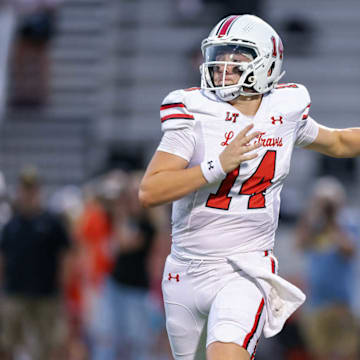 Austin Lake Travis quarterback Luke McBride looks to pass the ball in a game against Rockwall earlier this year. 