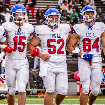 Los Alamitos captains take the field before taking on Inglewood on August 25, 2025.