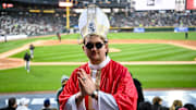 A White Sox fan dressed as the pope attends a game against the Miami Marlins.