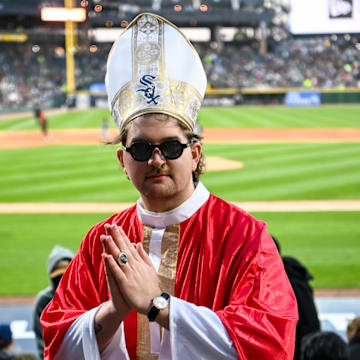 A White Sox fan dressed as the pope attends a game against the Miami Marlins.