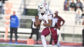 Kankakee junior quarterback Phillip Turner looks for a pass in a game against Lincoln-Way East on September 7, 2025. 