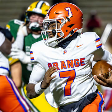 Olentangy Orange QB Levi Davis runs the ball against St. Edward in the OHSAA Division I state semifinals on Nov. 28, 2025 at Mansfield's Arlin Field.