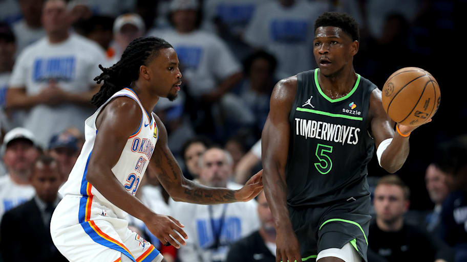 Anthony Edwards deals a pass against the Oklahoma City Thunder. | Matthew Stockman/Getty Images