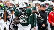 Michigan State's Nick Marsh, left, runs after a catch against UCLA during the first quarter on Saturday, Oct. 11, 2025, at Spartan Stadium in East Lansing.