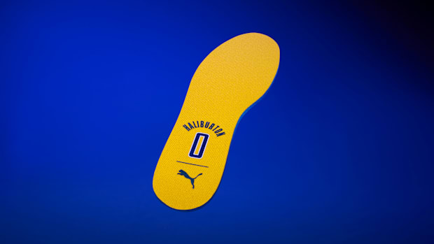 Yellow and blue PUMA outsole.