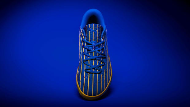 Blue and yellow PUMA sneakers.