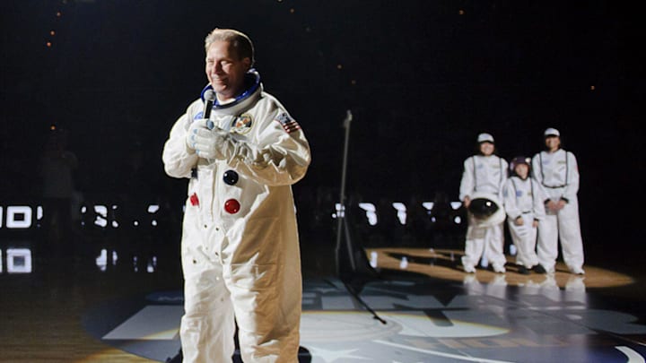 MSU Men's Basketball head Coach Tom Izzo (center) speaks to the crowd while wearing a space suit during Midnight Madness Friday October 15, 2010 in East Lansing.  The event had an outerspace theme as the Final four this season will be held in Houston, the home of NASA.

Midnight Madness