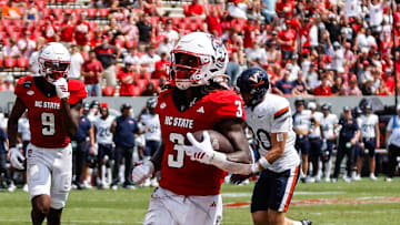 Sep 6, 2025; Raleigh, North Carolina, USA; North Carolina State Wolfpack running back Hollywood Smothers (3) runs with the football to score a touchdown during the second half of the game against Virginia Cavaliers at Carter-Finley Stadium. Mandatory Credit: Jaylynn Nash-Imagn Images