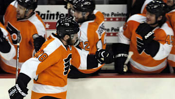 May 25, 2010; Philadelphia, PA USA;  Philadelphia Flyers center Mike Richards (18) celebrates with teammates after scoring a shorthanded goal during the 1st period of Game 5 of the Eastern Conference Finals against the Montreal Canadiens at the Wachovia Center. Mandatory Credit: Eric Hartline-Imagn Images
