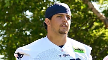 Jul 23, 2025; Foxborough, MA, USA; New England Patriots offensive tackle Will Campbell (66) and wide receiver Mack Hollins (13) walk to the practice fields for training camp at Gillette Stadium. Mandatory Credit: Eric Canha-Imagn Images