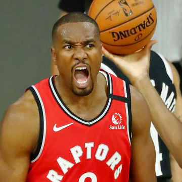 Aug 21, 2020; Lake Buena Vista, Florida, USA; Toronto Raptors center Serge Ibaka (9) celebrates after making a basket against the Brooklyn Nets during the second half in game three of the first round of the 2020 NBA Playoffs at The Field House. Mandatory Credit: Kim Klement-USA TODAY Sports