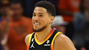 Apr 25, 2023; Phoenix, Arizona, USA; Phoenix Suns guards Devin Booker (1) smiles after a shot against the Los Angeles Clippers during the first half in game five of the 2023 NBA playoffs at Footprint Center. Mandatory Credit: Mark J. Rebilas-Imagn Images
