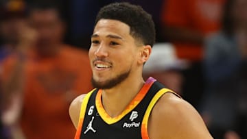 Apr 25, 2023; Phoenix, Arizona, USA; Phoenix Suns guards Devin Booker (1) smiles after a shot against the Los Angeles Clippers during the first half in game five of the 2023 NBA playoffs at Footprint Center. Mandatory Credit: Mark J. Rebilas-Imagn Images
