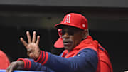May 31, 2025; Cleveland, Ohio, USA; Los Angeles Angels manager Ron Washington (37) holds up four fingers while intentionally walking Cleveland Guardians third baseman Jose Ramirez (not pictured) in the third inning at Progressive Field.