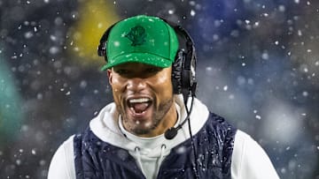 Nov 8, 2025; South Bend, Indiana, USA; Notre Dame Fighting Irish head coach Marcus Freeman celebrates with running back Aneyas Williams (22) after he scored a touchdown against the Navy Midshipmen during the second half at Notre Dame Stadium. 