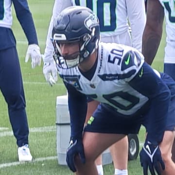 Seattle Seahawks linebacker Patrick O'Connell participates in a sled drill at OTAs.