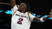 Dec 6, 2025; Phoenix, Arizona, USA; Arizona State University Sun Devils guard Anthony Johnson (2) dunks over Oklahoma University Sooners guard Jadon Jones (12) in the second half at PHX Arena. Mandatory Credit: Anna Carrington-Imagn Images