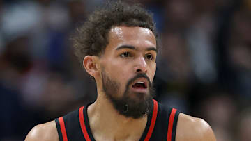 Trae Young #11 of the Atlanta Hawks looks to make a play against the Denver Nuggets.