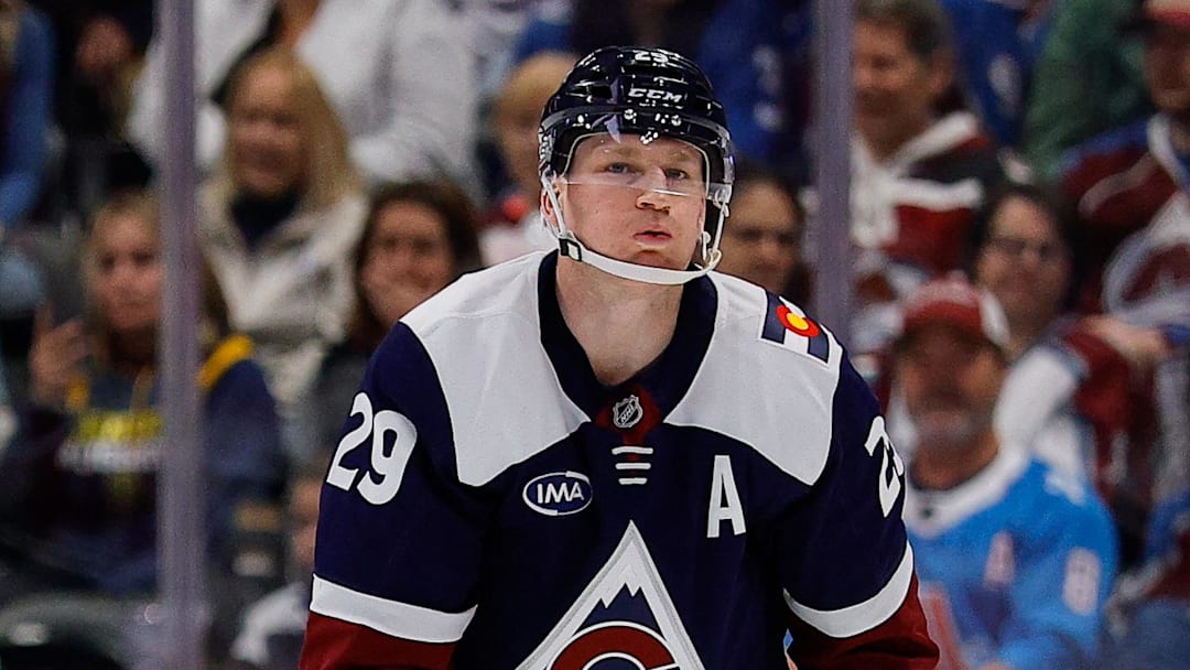 Mar 8, 2026; Denver, Colorado, USA; Colorado Avalanche center Nathan MacKinnon (29) holds his knee after a play in the first period against the Minnesota Wild at Ball Arena. Mandatory Credit: Isaiah J. Downing-Imagn Images