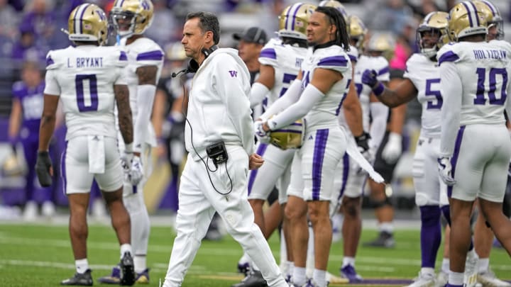 Washington head coach Jedd Fisch walks on the field during the team's 2024 spring game.